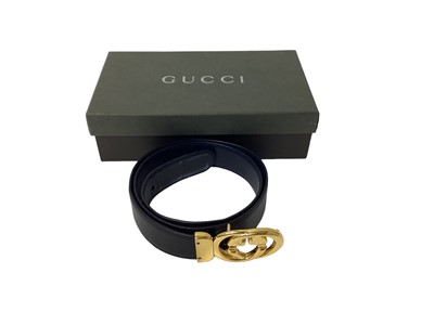 Lot 2060 - Gucci black leather waist belt, with gilt metal 'GG' logo buckle, in a Gucci box