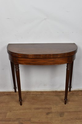 Lot 1258 - Regency mahogany and ebony inlaid D-shaped tea table, raised on turned legs and spool feet, 91cm wide x 35cm deep x 76cm high