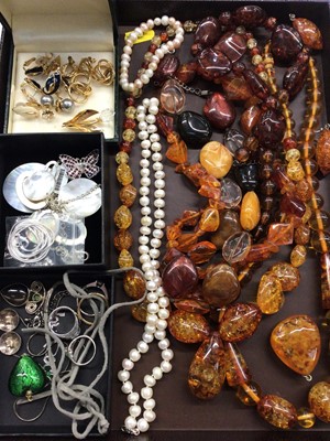 Lot 1002 - Amber and amber type bead necklaces, cultured pearl necklace and bracelet, Swarovski rose brooch, clip on earrings and some silver jeweller