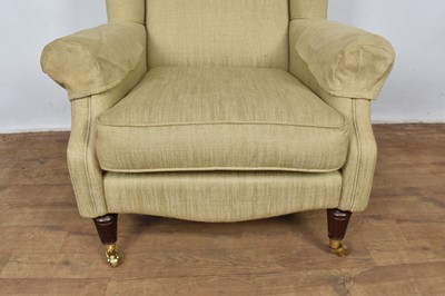 Lot 1261 - Laura Ashley wing armchair, raised on fluted legs and castors