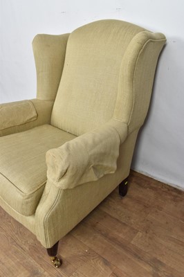 Lot 1261 - Laura Ashley wing armchair, raised on fluted legs and castors