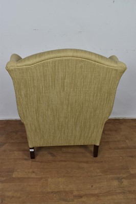 Lot 1261 - Laura Ashley wing armchair, raised on fluted legs and castors