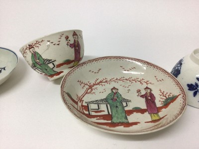 Lot 67 - Three 18th century Liverpool tea bowls and saucers, including one decorated in polychrome enamels with Chinese figures, one with fruit and another with flowers