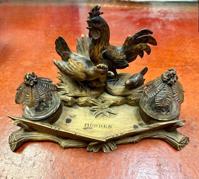 Lot 79 - Antique Black Forest carved desk inkstand decorated with cockerel, hen and chicks, twin glass inkwells, engraved 'Mürren'