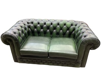 Lot 1202 - Green leather chesterfield sofa