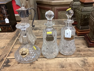 Lot 22 - Pair of cut glass decanters with silver wine labels, and two other glass decanters