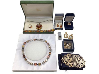 Lot 1019 - Group of silver mounted amber and other jewellery, plated belt buckle, military badges and a cigar cutter