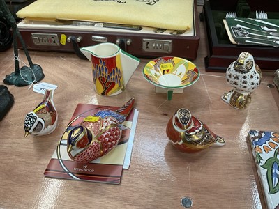 Lot 419 - Wedgwood Clarice Cliff collection milk jug and sugar bowl, together with four Royal Crown Derby Imari pattern bird paperweights (6)