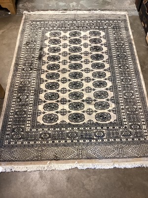 Lot 1368 - Eastern rug geometric decoration on cream ground.