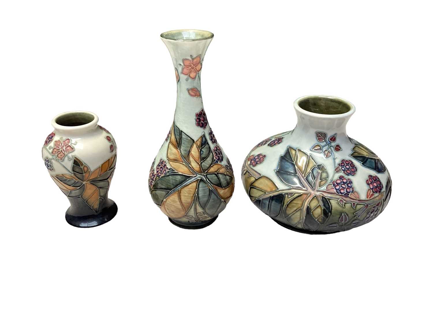 Lot 1111 - Three Moorcroft bramble pattern vases