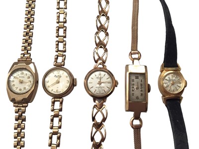 Lot 35 - Four 9ct gold ladies wristwatches all on 9ct gold bracelets and 18ct gold cased watch on leather strap