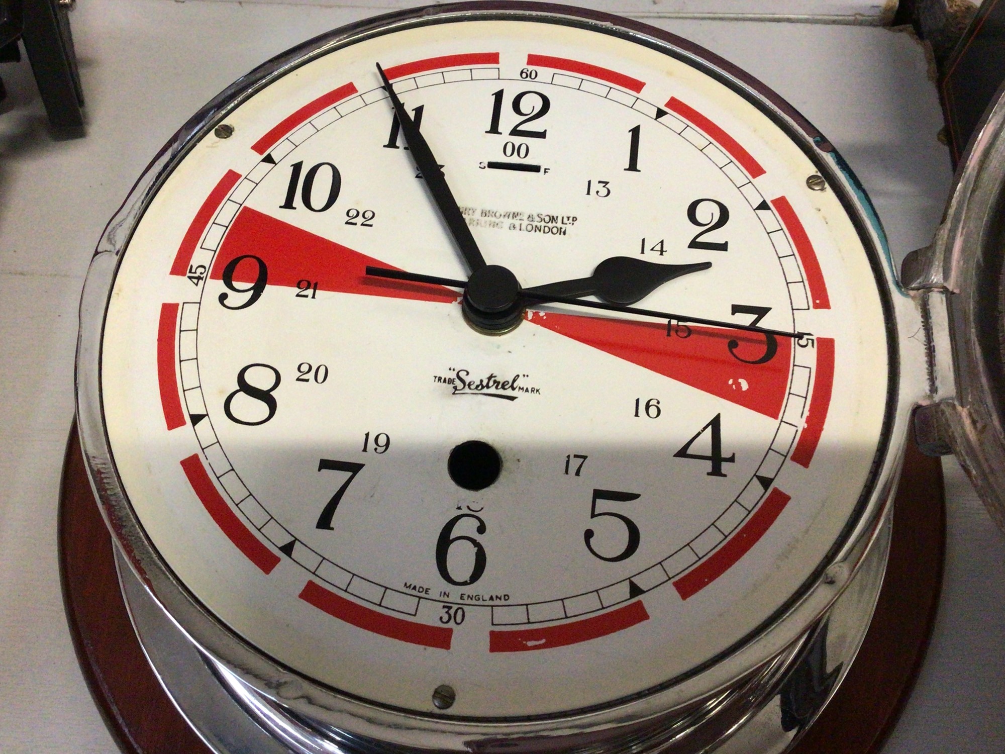 Sestrel Clock Lot 310 - Sestrel ship's bulkhead clock by Henry