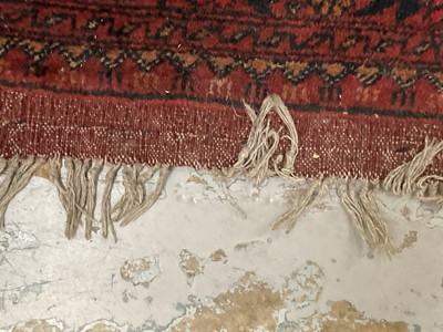 Lot 1430 - Large Eastern rug on red ground, previously purchased from Harrods