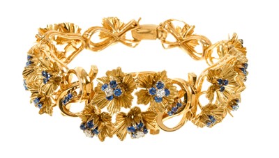 Lot 621 - 14ct gold floral cluster bracelet set with round mixed cut sapphires and brilliant cut diamonds, 19cm long