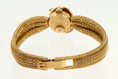 Lot 711 - 1950s/1960s lady's Omega 18ct gold and diamond cocktail bracelet watch