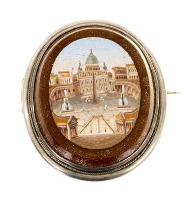 Lot 640 - Grand Tour micro-mosaic brooch with an oval panel depicting St Peter's Basilica on a goldstone ground in a white metal brooch mount