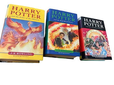 Lot 1708 - Three First Edition Harry Potter books to include the Half-Blood Prince with rare page 99 printing error with the misprint 'eleven owls'. Order of The Phoenix and Deathly Hallows