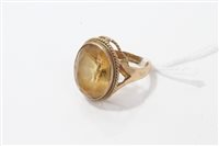 Lot 3287 - Gold (9ct) yellow stone dress ring. Size M