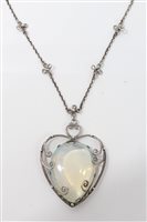 Lot 3289 - Arts & Crafts-style pendant with polished pear-...