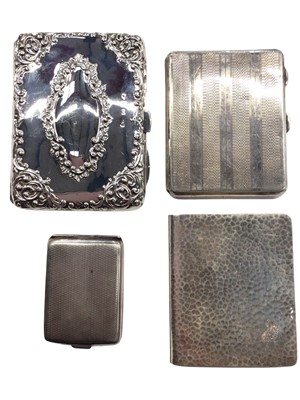 Lot 1067 - Three silver cigarette cases and a silver match case (4)