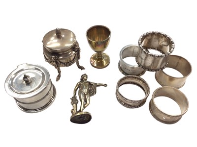 Lot 1070 - Group of five silver napkin rings, silver gilt...