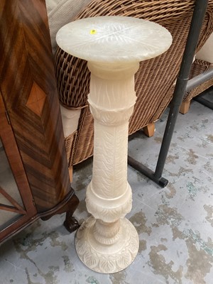 Lot 1250 - Carved stone torchere