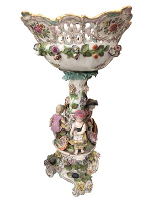 Lot 337 - Large continental table centre with figure and floral decoration, together with a pair of similar style candelabrum, both damaged