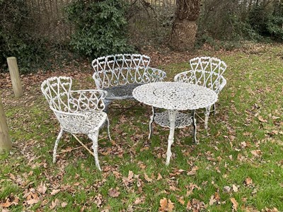 Lot 1339 - Victorian style cast metal garden suite comprising bench, pair of chairs and a table