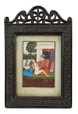 Lot 925 - 19th century Indo-Persian School, gouache on ivory depicting a nobleman and courtesans, 11 x 7cm, glazed relief carved easel frame