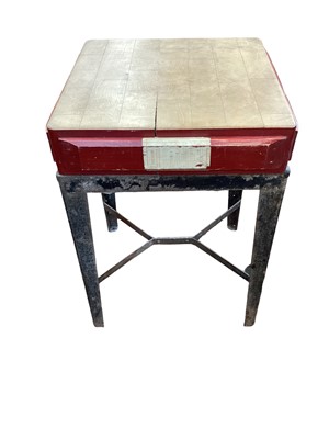 Lot 1524 - Contrived industrial steel table utilising shoe makers hand cutting board, for cutting leather, the cutting block carries an instruction label from the British Union of S...