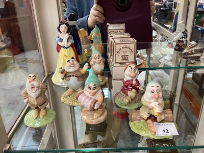 Lot 12 - Royal Doulton Snow White and six dwarf figures and six Wade Bear Ambitions figures in boxes