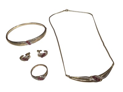 Lot 202 - Ruby and diamond suite of jewellery in 9ct gold setting to include a necklace, bangle, ring and earrings