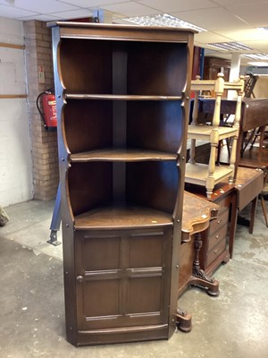 Lot 1309 - Ercol corner cupboard, drop flap occasional table and two elbow chairs (4)