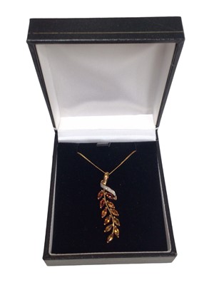 Lot 212 - Citrine and diamond pendant, the stylised floral spray with marquise cut citrines and single cut diamonds in 9ct yellow gold setting on chain