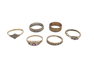 Lot 1035 - 18ct gold diamond ring in platinum setting, 9ct gold wedding ring and four 9ct gold gem set rings (6)