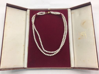 Lot 1050 - Cultured freshwater pearl two strand necklace with 9ct gold clasp