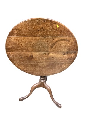 Lot 1303 - Antique tilt top wine table on turned column and three hipped splayed legs, 75cm diameter