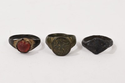 Lot 845 - Medieval bronze ring, another set with red stone and a Viking ring