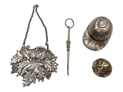 Lot 1077 - White metal 'Hock' label, caddy spoon in the form of a hat and two other items