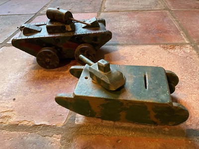 Lot 1561 - Homemade wooden money box in the form of an army tank, camouflage painted and inscribed ‘Save for Elizabeth Ann’, further inscribed on base ‘made by Harriet Bocco, 89 Cyncoed road, Cardiff, 9inches...