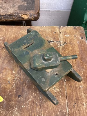 Lot 1561 - Homemade wooden money box in the form of an army tank, camouflage painted and inscribed ‘Save for Elizabeth Ann’, further inscribed on base ‘made by Harriet Bocco, 89 Cyncoed road, Cardiff, 9inches...