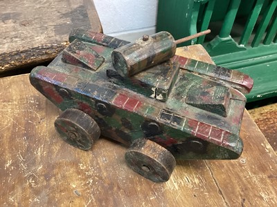 Lot 1561 - Homemade wooden money box in the form of an army tank, camouflage painted and inscribed ‘Save for Elizabeth Ann’, further inscribed on base ‘made by Harriet Bocco, 89 Cyncoed road, Cardiff, 9inches...