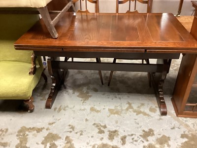 Lot 1312 - Old Charm oak draw leaf dining table on end standards joined by stretcher, 137.5cm x 84cm, opening to 213.5cm, together with a set of four Ercol dining chairs with wavy splat backs