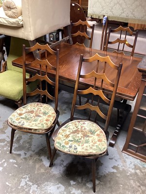 Lot 1312 - Old Charm oak draw leaf dining table on end standards joined by stretcher, 137.5cm x 84cm, opening to 213.5cm, together with a set of four Ercol dining chairs with wavy splat backs