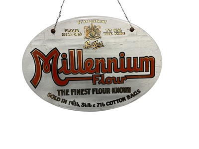 Lot 120 - Early 20th century oval glass 'Spillers Millennium Flour, The Finest Flour Known' shop sign with suspension chain, 34.8cm in diameter.