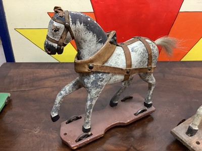 Lot 1577 - Three 19th century child's carved horses on wheeled bases