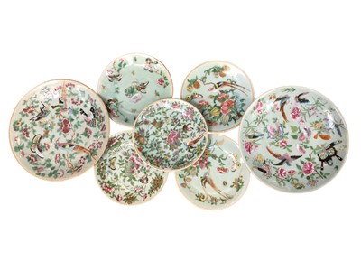 Lot 46 - Seven late 19th century Chinese famille rose celadon-glazed porcelain dishes, decorated with flowers and birds