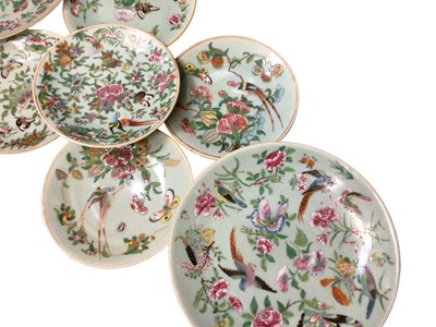 Lot 46 - Seven late 19th century Chinese famille rose celadon-glazed porcelain dishes, decorated with flowers and birds