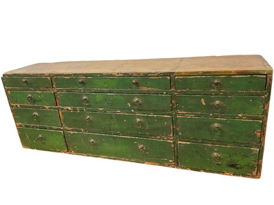 Lot 1591 - Antique bank of twelve drawers with original green paint