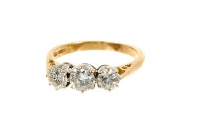 Lot 626 - Diamond three stone ring with three brilliant cut diamonds in claw setting on 18ct yellow gold shank